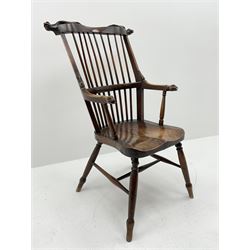 Unusual 19th century elm and beech high comb back Windsor armchair, the serpentine cresting rail carved with serpent heads over stick back, the arms with serpent head carved terminals, dished seat, turned supports joined by H stretcher