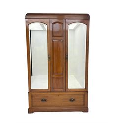 Edwardian walnut double wardrobe, fitted with two bevelled mirror panelled doors, single drawer to base