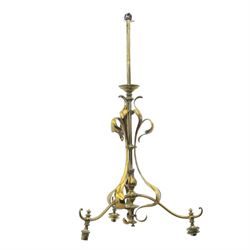 20th century Art Nouveau brass wall light, vertical stem with three scrolling arms termina...