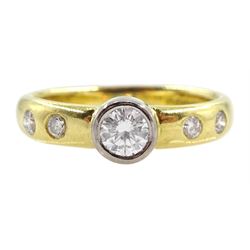 18ct gold diamond ring, the central bezel set diamond approx 0.25 carat, with two diamonds either side set in the shoulders by Peter Brewer, hallmarked