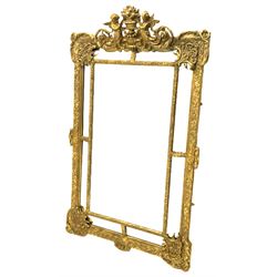 Large Victorian style gilt cushion framed mirror, putti holding urn with scrolled foliage pediment above central rectangular bevelled plate, the frame decorated with moulded foliate, each corner set with ornate cartouche