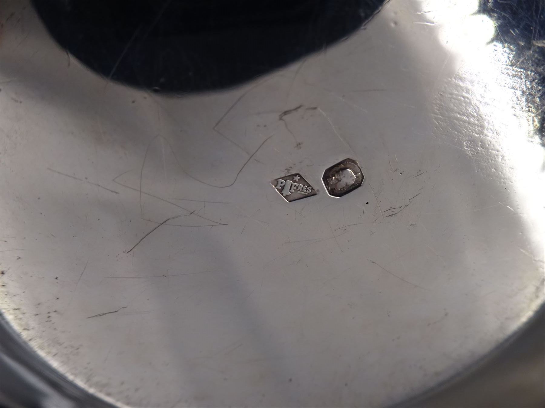 French silver cup and saucer, with embossed floral decoration throughout and openwork floral handle, stamped with Minerva's head and maker's mark for 	P. Fres Paris, cup H5.5cm