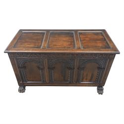 17th century design panelled oak blanket chest, hinged top above carved triple arch frieze, raised on individual carved claw feet