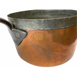 19th century large and heavy seamed copper saucepan with fixed iron handle, impressed 'Harrods Stores Limited London', with family crest of a crown over a letter 'C', L61cm