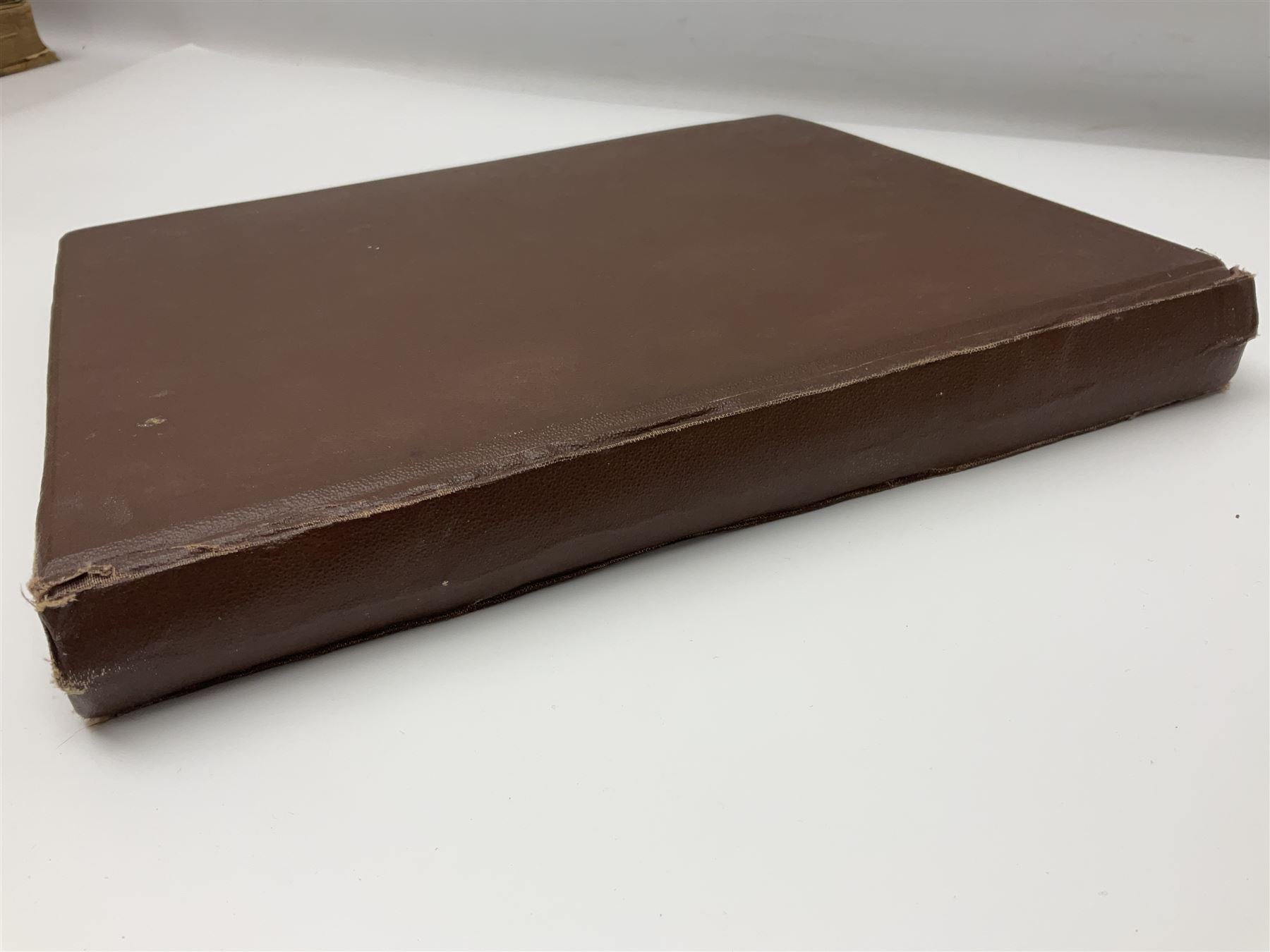 Album of WWII era paper ephemera, to include cartoon illustrations by George Goodwin Butterworth and Clive Uptton, articles and photographs