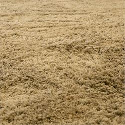 Next Home - large beige coloured cosy twist rug, polyester main with a cotton backing