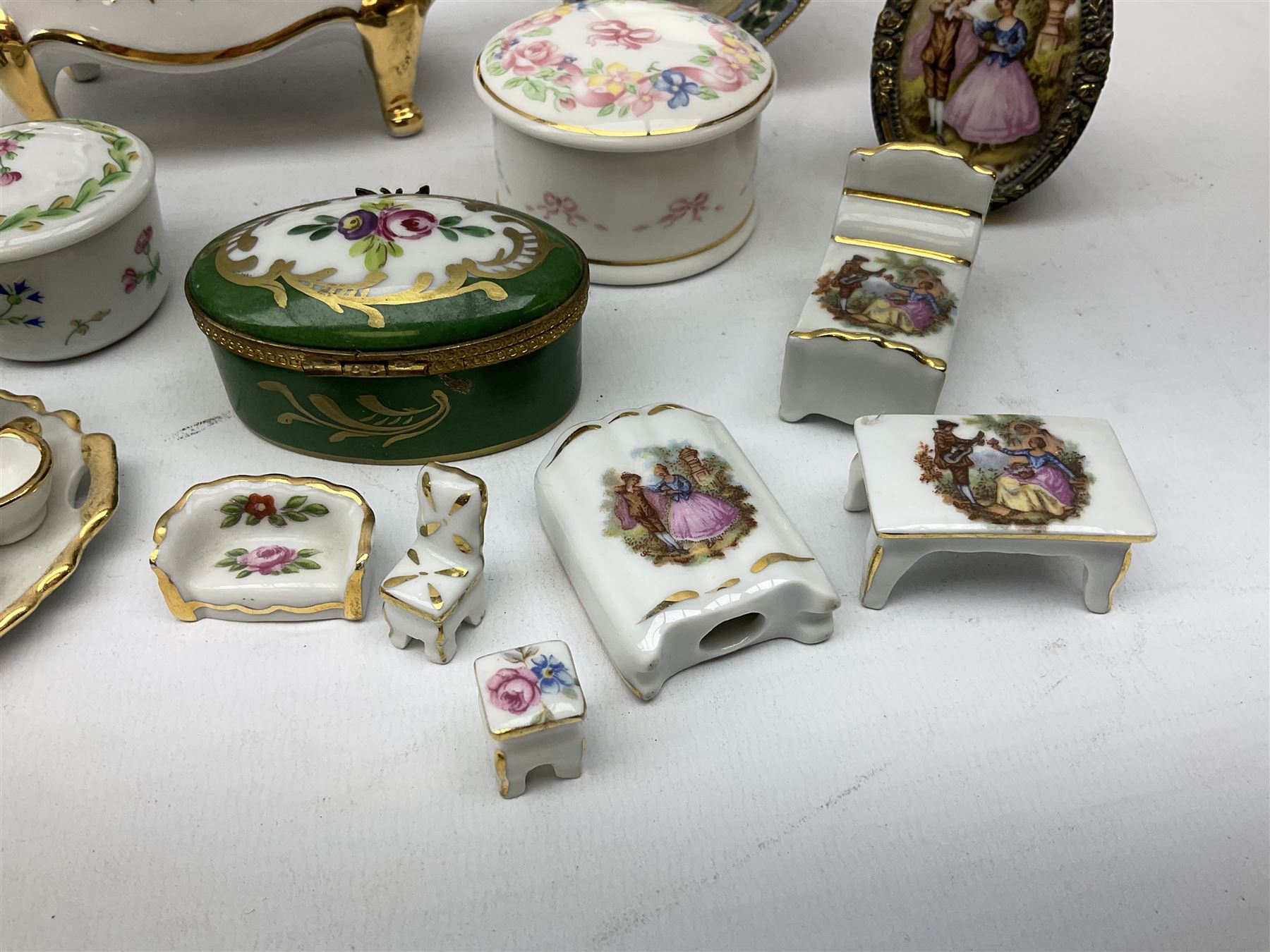 Limoges La Reine miniature furniture to include two chairs and table set, wardrobe etc, Limoges lidded boxes to include Bernadaud example, Limoges miniature tea service on tray, other boxes and miniatures to include Spode twin handled loving cup etc