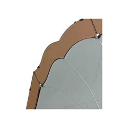 Frameless art deco mirror, scalloped copper tinted border central fan motif, bevelled edges with decorative screw caps