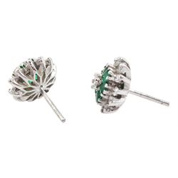 Pair of 18ct white gold emerald and round brilliant cut diamond flower head cluster stud earrings, London 1978 