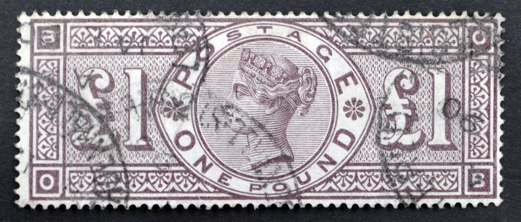 Queen Victoria one pound brownlilac stamp, with various postmarks