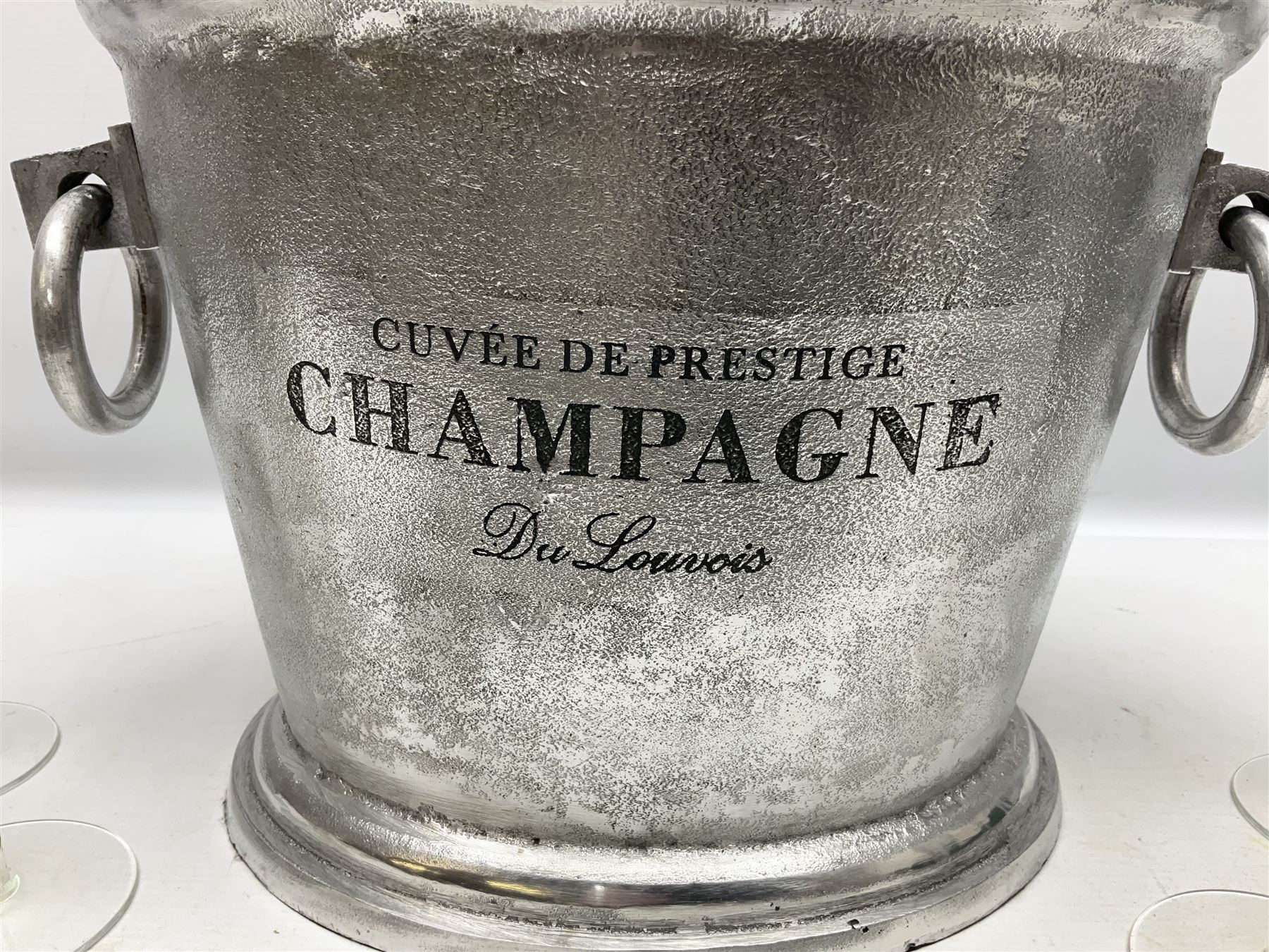 Aluminium champagne bucket detailed Cuvee de Prestige Champagne du Louvois, with twin ring handles, together with quantity of glasses, bucket L38cm