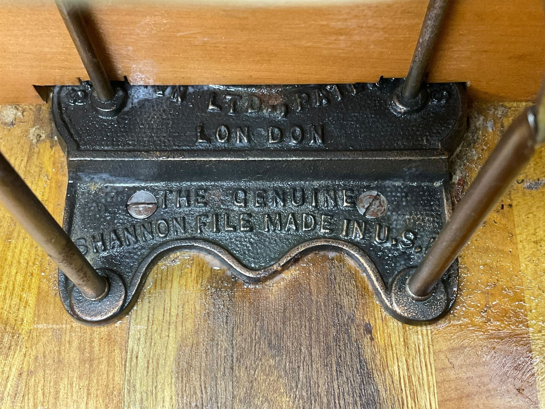 The Shannon Limited - late Victorian walnut filing cabinet, fitted with twenty-four small filing drawers, each with brass handle with label holder, fluted uprights, double cupboard below enclosed by two panelled doors, on turned feet, with brass plaque inscribed 'The Shannon, Limited, Ropemaker St. London, E.C.'