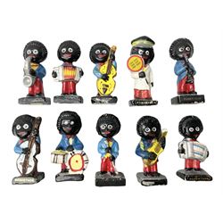 Robinson Jam plaster Golly band, including drummer and singer, H7.5cm

Originally handmade by mothers in Africa for their children from old fabric and cloth, the golly doll was adopted as the mascot and trademark for the Robertson's confectionery brand around 1910 after the company's founder John Robertson visited the US and noticed children playing with them. Robertson's Gollies have been collected by people across the UK and around the world for generations but garnered a contentious image in the 1980s because of links to racism. The trademark was removed from Robertson's branding in 2001.