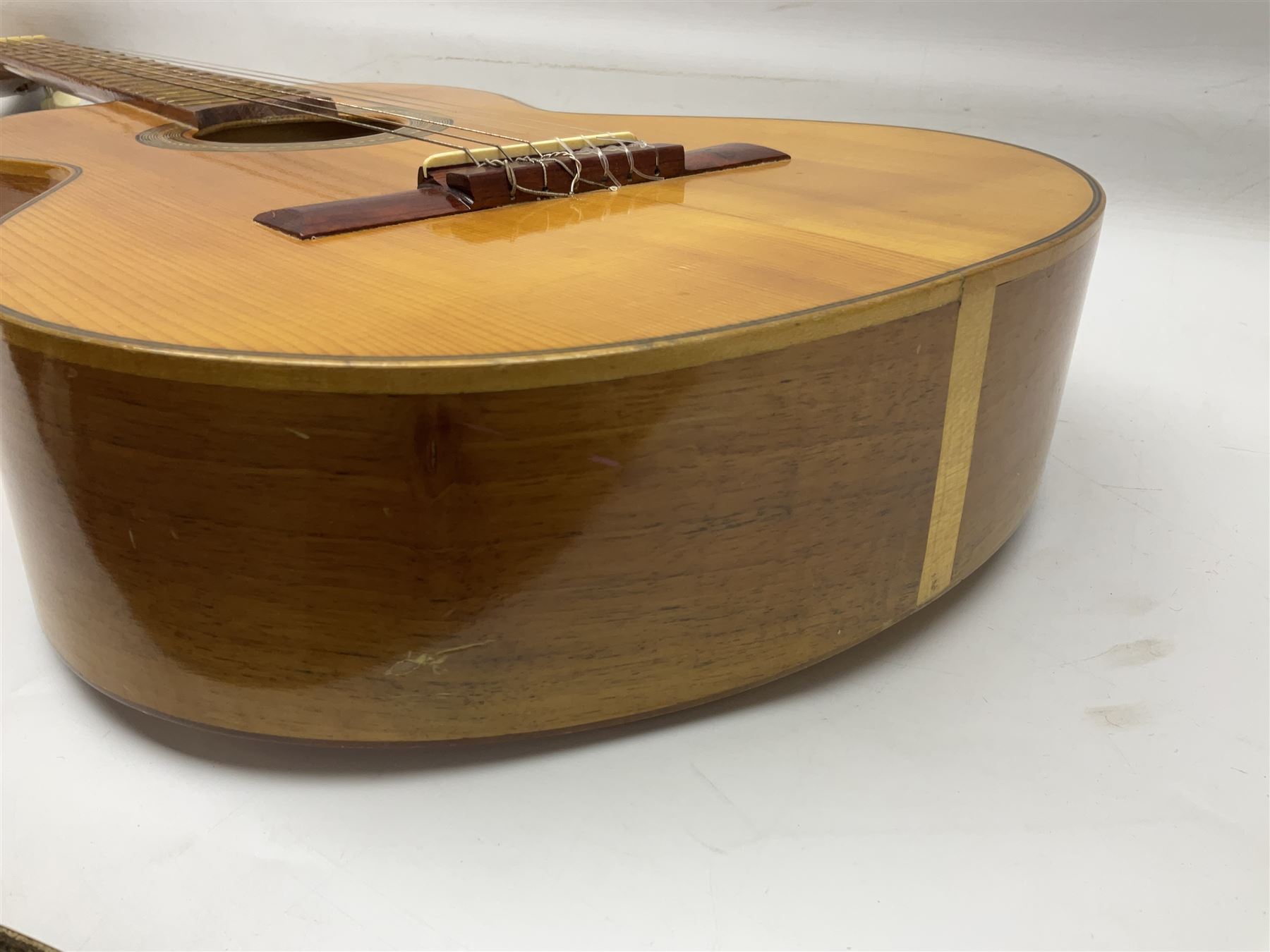 Encore black electric cut-away guitar L96cm; and Spanish Victor Garcia model 187 acoustic guitar, bears label dated 1972 L99cm; each in soft carrying case (2)