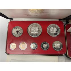 Four Papua New Guinea proof eight coin sets, from ten kina to one toea, comprising First Coinage of Papua New Guinea 1975 proof set, 1976, 1977, and 1979 proof sets, the 1977 and 1979 sets containing 925 silver ten kina and 500 silver five kina coins, all minted at the Franklin Mint, cased with certificates (4)