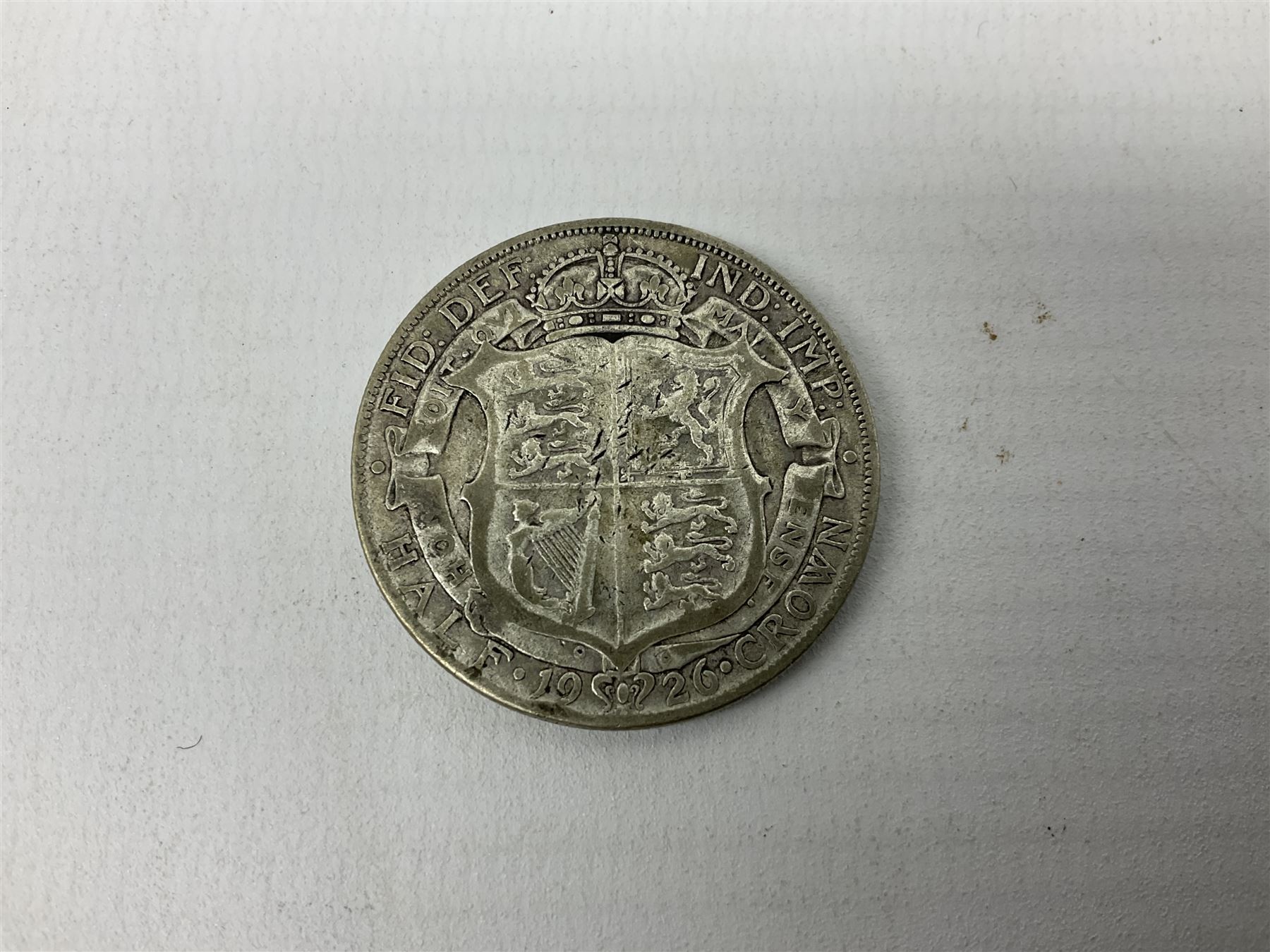 Approximately 28 grams of pre 1920 silver coins including four pence pieces and approximately 120 grams of pre 1947 silver coins including 1926 halfcrown etc