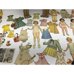 Two 37cm Shirley Temple cut-out paper and plywood dolls for dressing; and a quantity of other smaller Shirley Temple card/paper dolls with assorted clothing, one marked 'MCMXXXV E. Saalfield Pub. Co.'