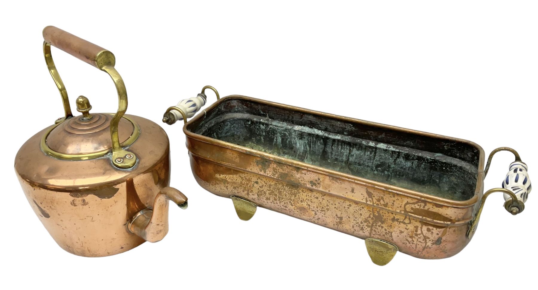 Copper planter of rectangular form with brass feet and twin handles, together with a brass mounted copper kettle, longest L54cm