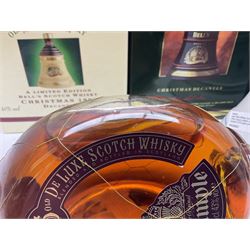 Dimple 15 Year Old Blended Scotch Whisky, together with nine Bells, scotch whisky, in Wade ceramic decanters, including Christmas 1991, 1998, 1996 etc, of various contents and proof 