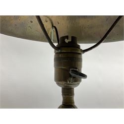 Arts & Crafts Jesson, Birkett & Co, brass table lamp or wall light, designed by Thomas Birkett, the tapering stem with adjustable ball pivot supporting a conical shade with tapering final with ball terminal, upon a circular domed base pierced for wall mounting, shade positioned upright overall H57cm

Often misattributed to Arthur Stansfield Dixon for Birmingham Guild of Handicraft, this particular lamp was designed by Thomas Birkett.
In the late 1890's Birkett worked as a metalwork at the Birmingham Guild, before later joining the Faulkner Bronze Company which went on to become Jesson, Birkett & Co in 1904. The lamp features in lighting catalogues from the firm under the model no E490.

