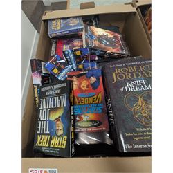 Large collection of Sci-Fi books and ephemera, including Star Wars, Star Trek and Doctor Who novels, in four boxes