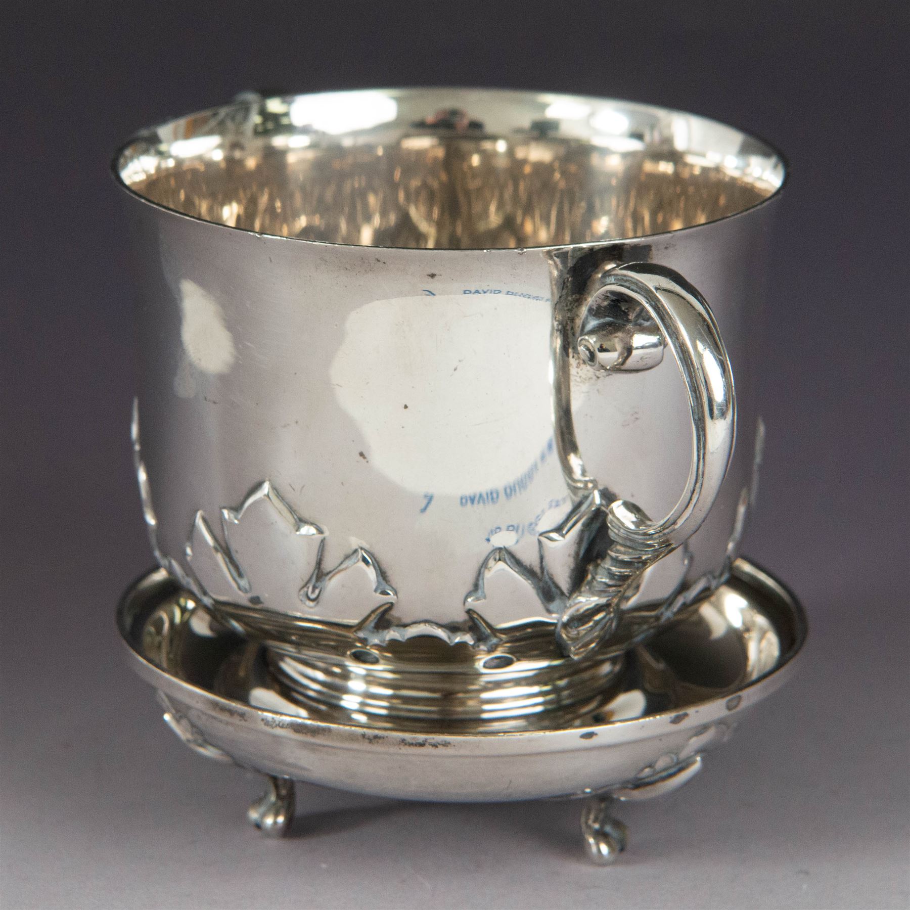 Early 20th century silver porringer, decorated in relief with foliate decoration and later engraving to body, upon a stepped circular foot, with matching cover/stand, both hallmarked Johnson, Walker & Tolhurst, London 1913, H8cm