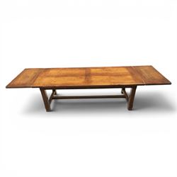 Country pine draw leaf table, bench seat and six chapel chairs, the top of plank construction, with two frieze drawers, additional leaves extending to 320cm, with bench seat and six elm chapel seats