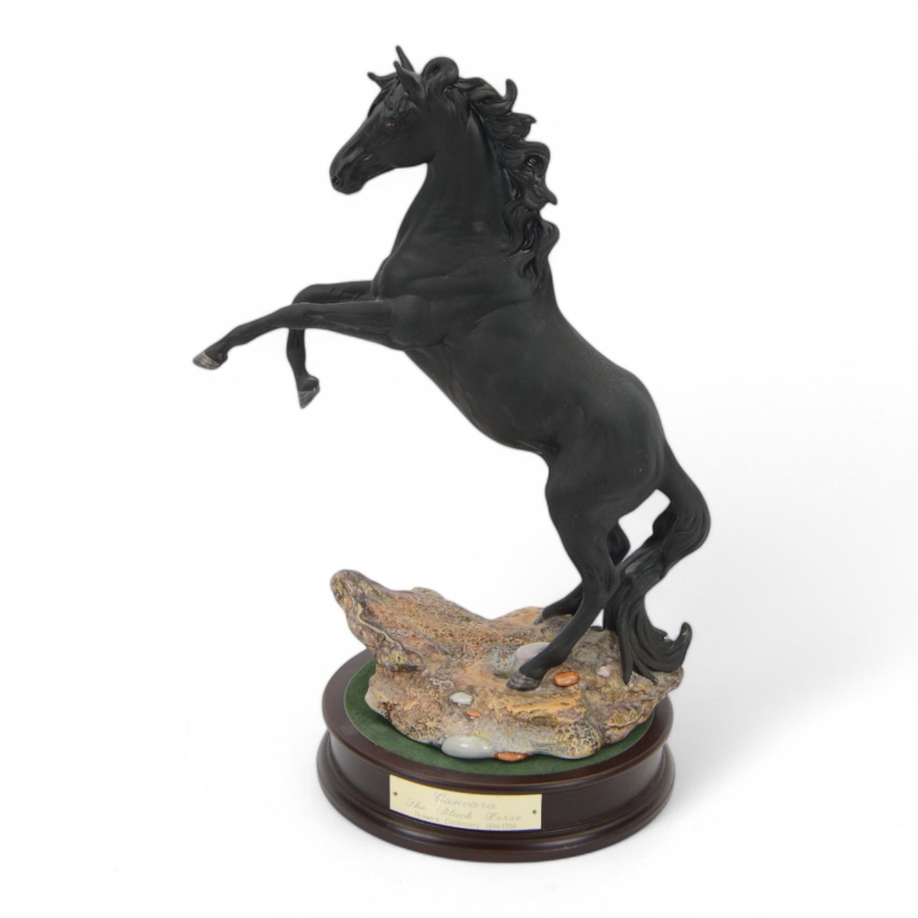 Beswick Cancara The Black Horse, designed by J. G. Tongue, modelled rearing horse on a naturalistic stony ground, upon a circular plinth with engraved title plaque, with certificate and in original box, H46cm 