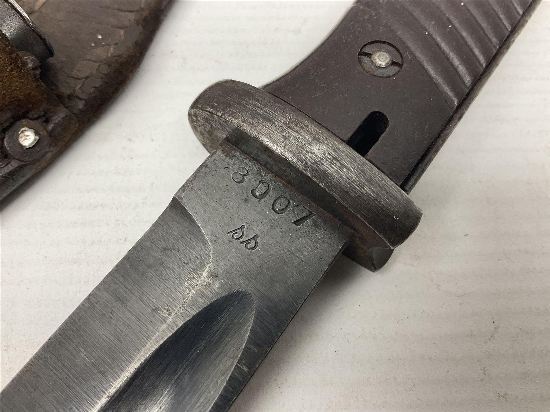 WWII German K98 Mauser bayonet by E. & F. Horster, the 24.5cm fullered blade marked 43aSW for 1943, numerous inspection marks to blade and pommel, bakelite grips and bluing to metal parts; in steel scabbard with corresponding numbers and leather frog L42cm overall