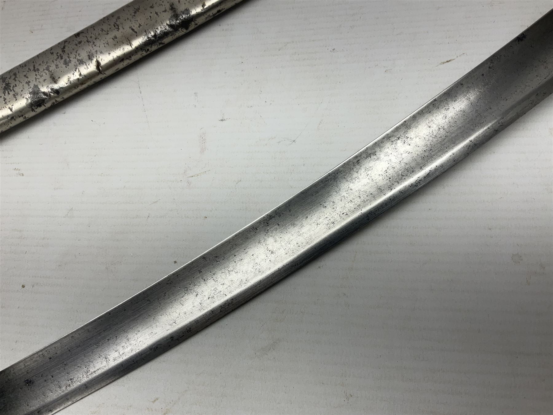 19th century Russian Imperial Navy sword, with 77.5cm curving fullered blade, brass three-bar hilt with lozenge shaped langets and wire-bound leather grip; in polished steel scabbard with one suspension ring L97cm overall