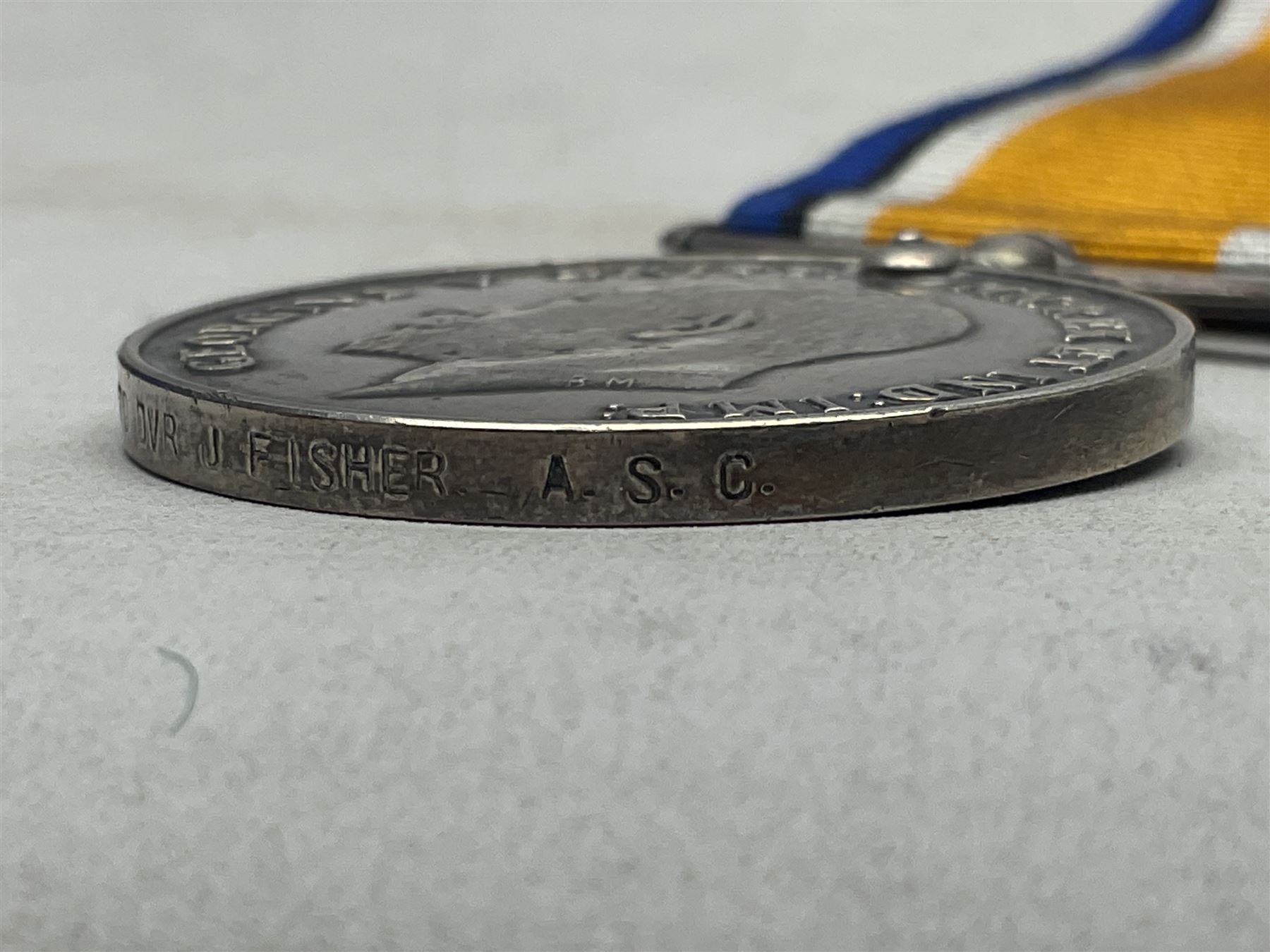 WW1 group of three medals comprising British War Medal, 1914-15 Star and Victory Medal awarded to 1270 Dvr. J. Fisher A.S.C.; and Territorial Efficiency Medal to T4-214571 Dvr. J. Fisher R.A.S.C.; all with ribbons (4)