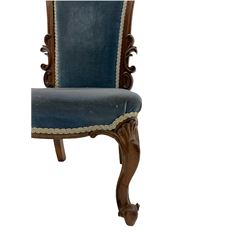 Victorian rose nursing chair, high arched back carved with scrolling foliage, serpentine seat upholstered in blue, on cabriole supports
