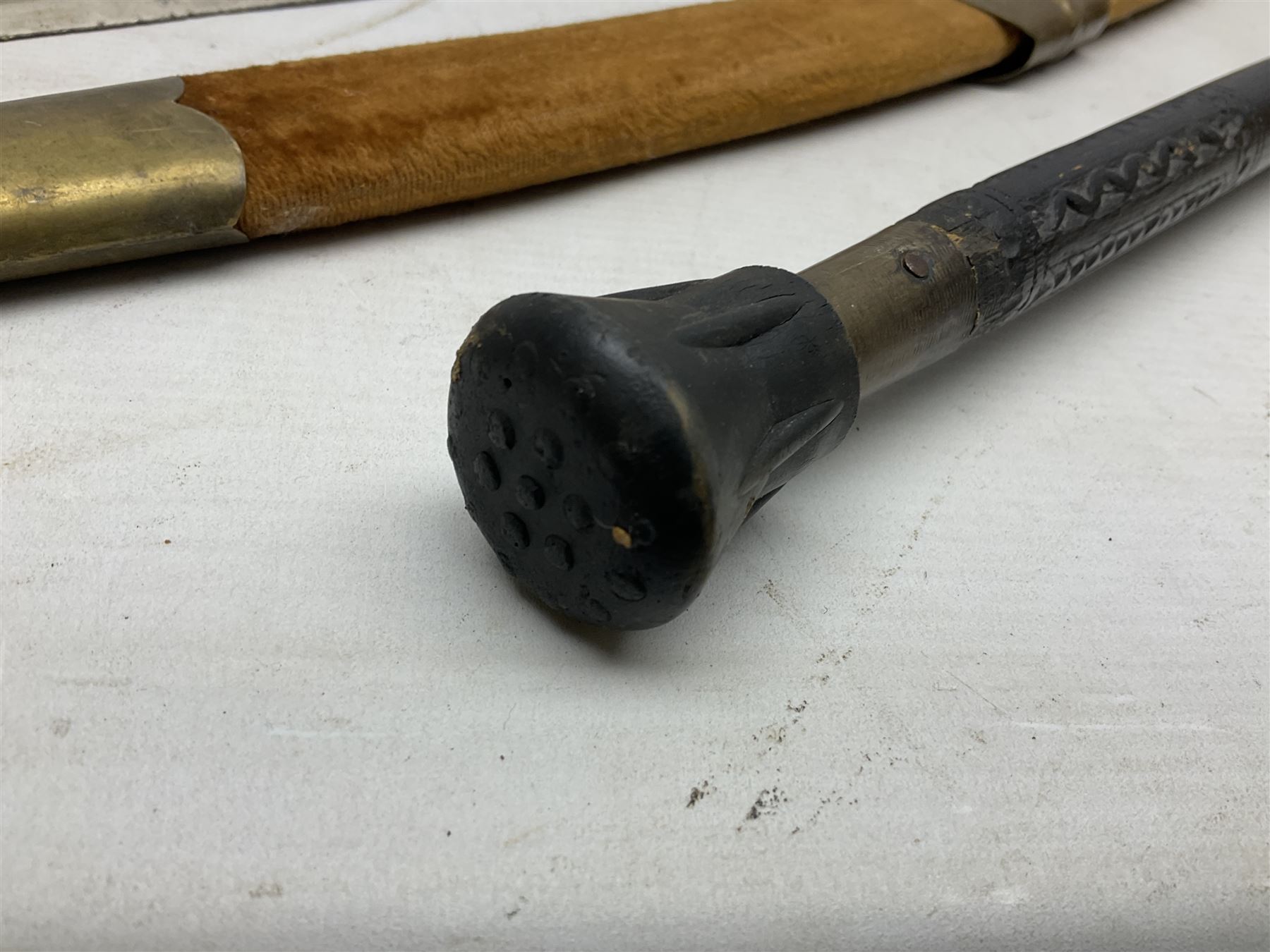 Early 20th century Indian ebonised sword stick, the 59.5cm blade with punched decoration and horn grip L94cm overall; and a reproduction Indian tulwar with scabbard (2)