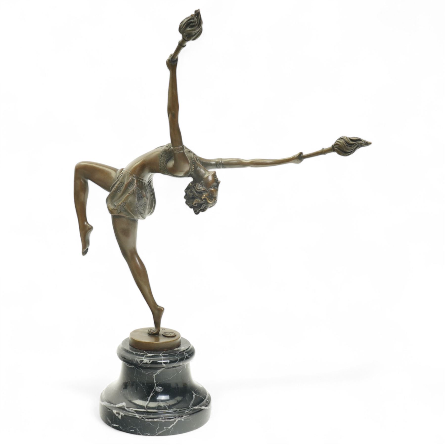 Art deco style bronze figure of a female dancing with flame torches, raised upon marble base, indistinctly signed, H43cm 