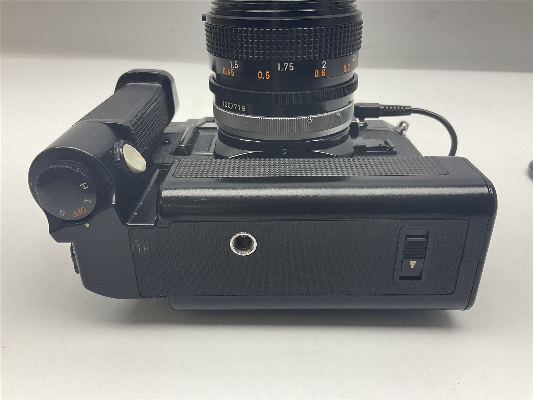 Canon A-1 camera body, serial no. 341014, with 'Canon FD 50mm 1:1.4 S.S.C.' lens, serial no. 12077119 and motor drive MA