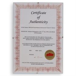 Half-size signed 1996 Michael Schumacher Ferrari helmet, signed at 2004 British Grand Prix, in display case with certificate of authenticity