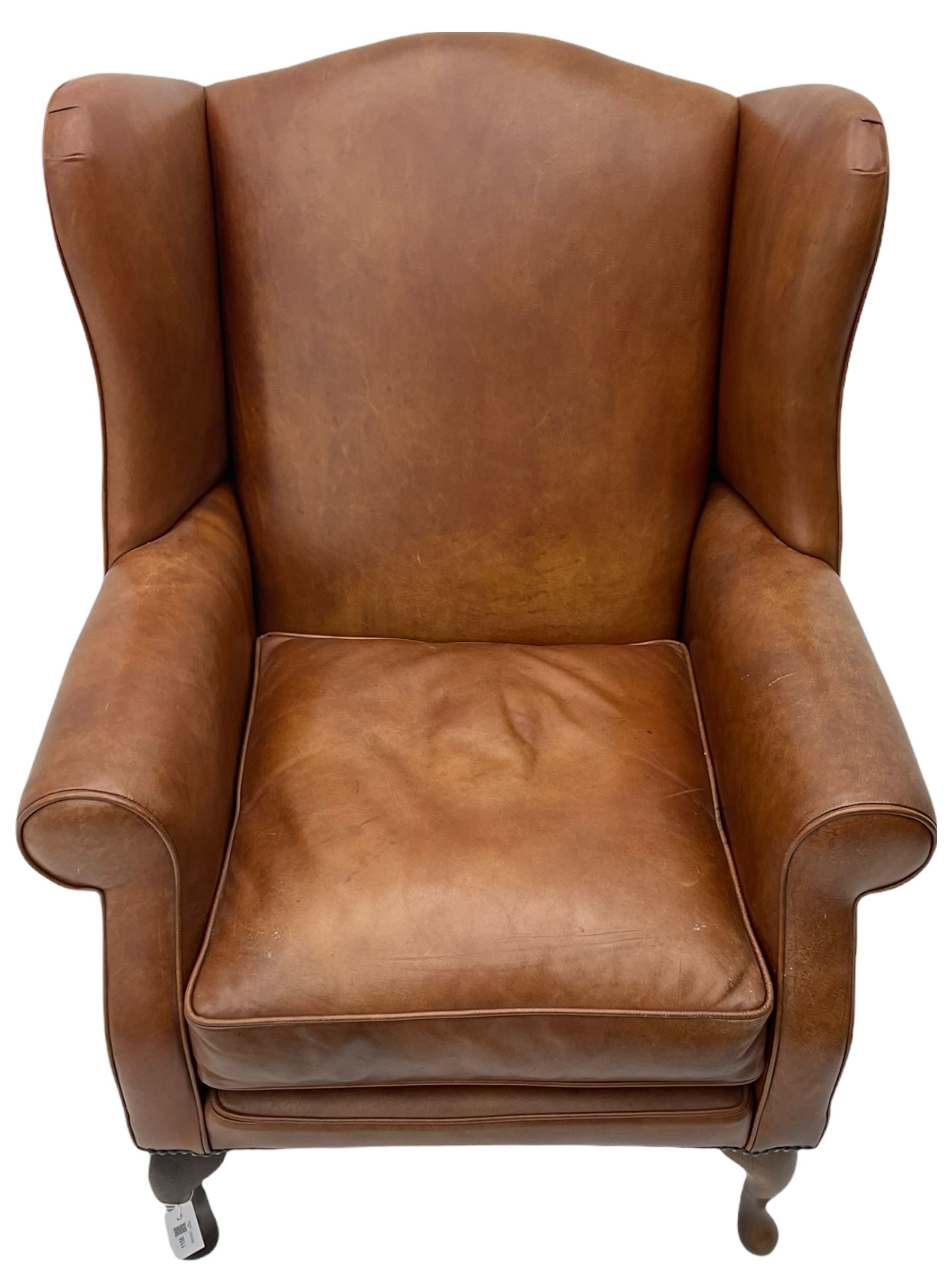 Laura Ashley wingback armchair upholstered in brown leather on cabriole front feet The Furnishings Sale Furniture Interiors Clocks
