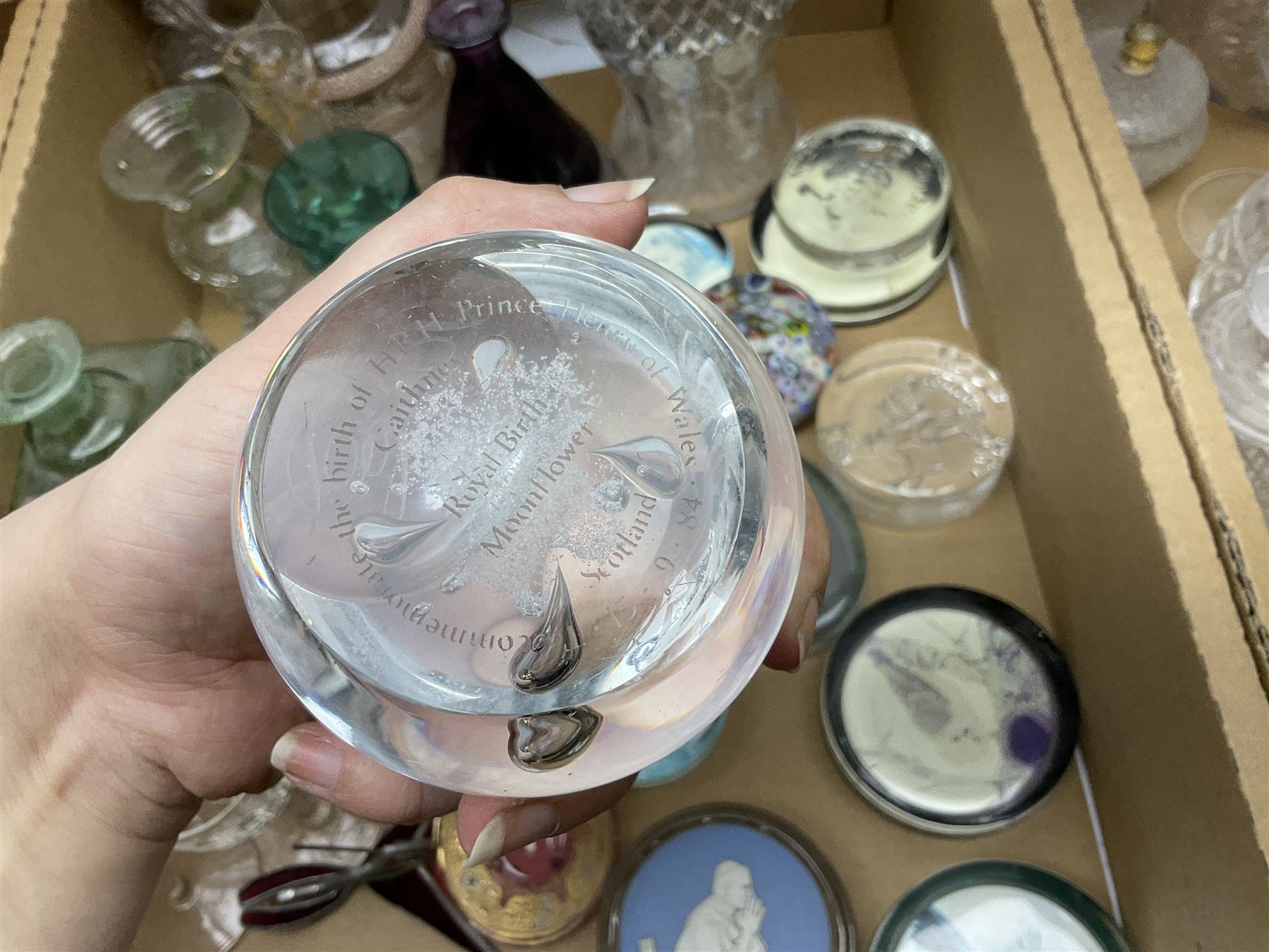 Millefiori paperweight, together with Caithness paperweight, Isle of Wight vase, cranberry glass tumblers, claret jug, decanters and other glassware, in three boxes 