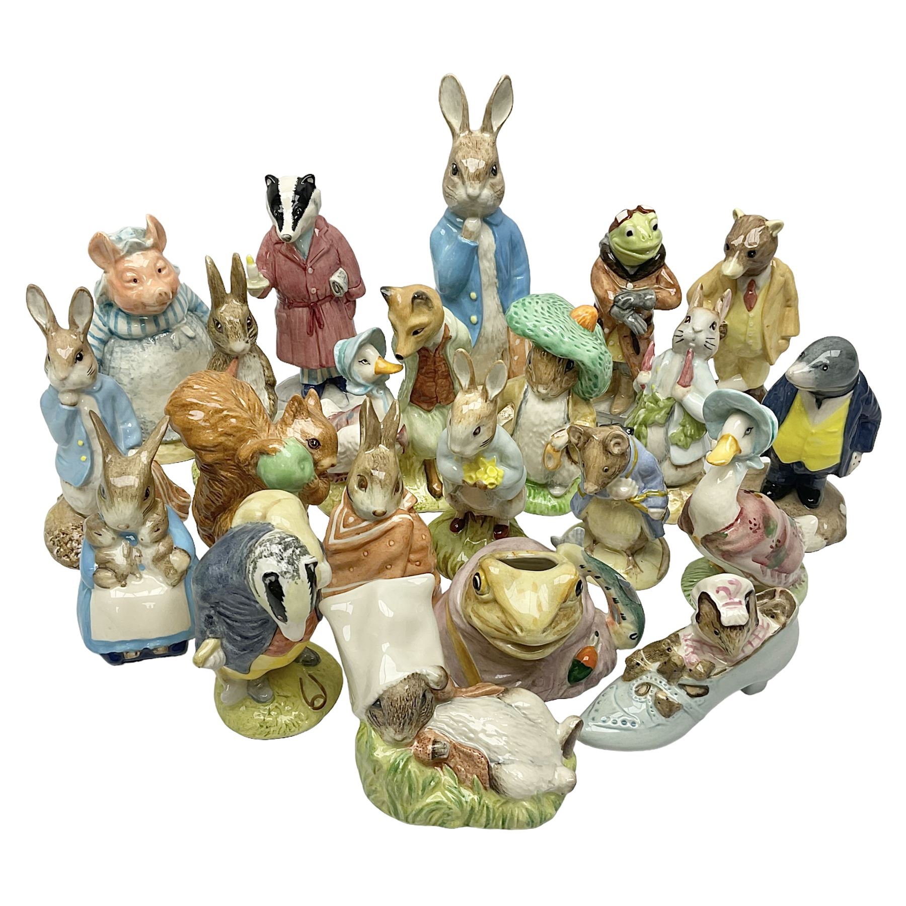 Sixteen Royal Albert Beatrix Potter figures, including Poorly Peter Rabbit, Jemima Puddle Duck and Squirrel Nutkin etc, all boxed together with a Beswick Beatrix Potter Jeremy Fisher miniature jug and four Beswick Wind in the Willows figures 