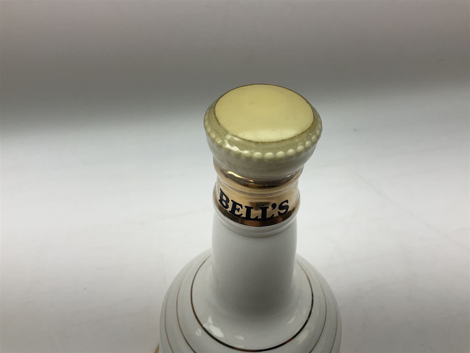 The Glenturret malt liqueur, 70cl, 35%vol and a Bell's Scotch Whisky decanter commemorating The marriage of Prince Andrew with Miss Sarah Ferguson 23rd July 1986, 75cl (2)