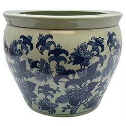 Chinese blue and white jardinière or fish bowl, the exterior decorated with flowers beneath a key fret border, the interior decorated with koi fish, with character mark beneath, H26cm D31cm