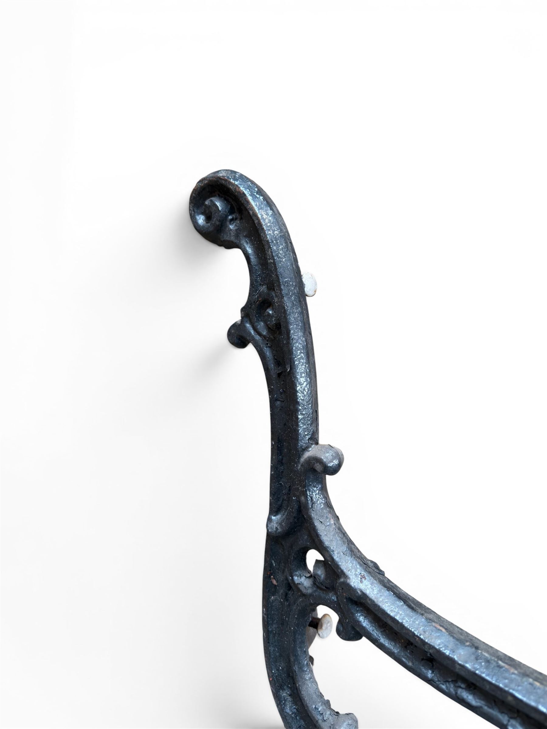 Carron Foundry - two pairs of 19th century cast iron garden bench ends, ornate detail with arms and X shaped legs,finish in black paint, the design no. 110396, first registered 13 July 1857 (see illustration), width as desired