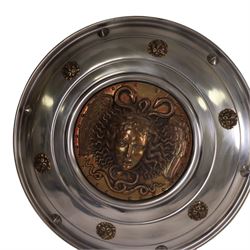 Three wall hanging shields the central panel decorated in relief with Medusa, D56cm 