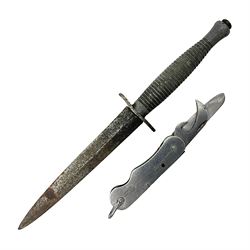 Fairburn Sykes style third pattern commando fighting knife, the 16cm double edged blade with central medial ridge, steel cross-piece marked with broad arrow and 'I', ribbed alloy grip L28cm overall (no scabbard); and Warriss Sheffield military pocket knife with two folding blades, marked with 'broad arrow 1953 and Oil The Joints' (2)