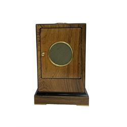 Knight & Gibbins London - 20th century 8-day marquetry inlaid mantle clock in rectangular case on a short plinth, glazed circular dial with Roman numerals and steel moon hands, two train striking movement with a floating balance escapement striking the hours and half hours on a bell, rear set and wound. With key.   