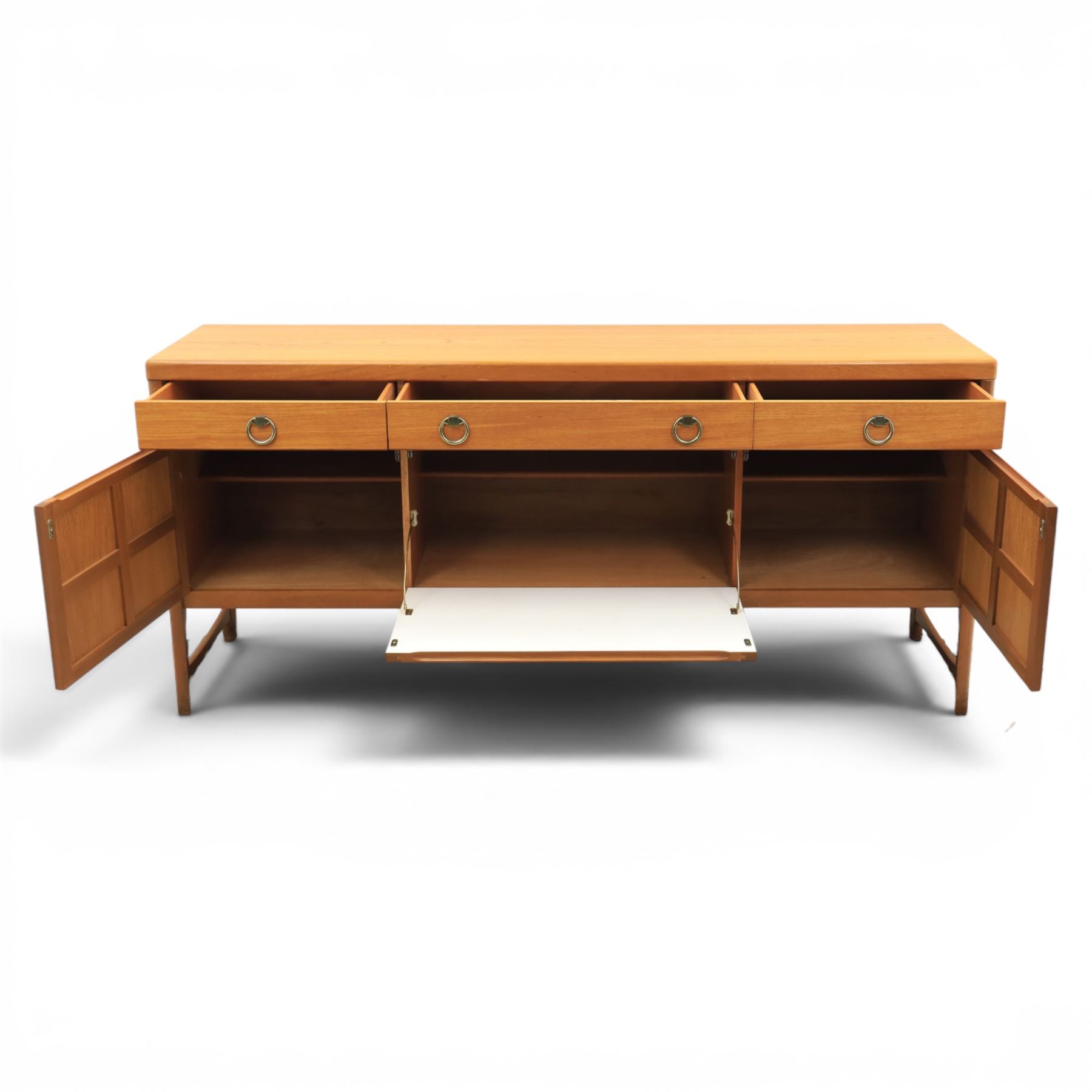 Nathan - 'Squares' mid 20th century teak sideboard, fitted with three drawers with brass ring handles, above a central fall front cabinet, flanked by two cupboard doors, raised on square tapering supports
