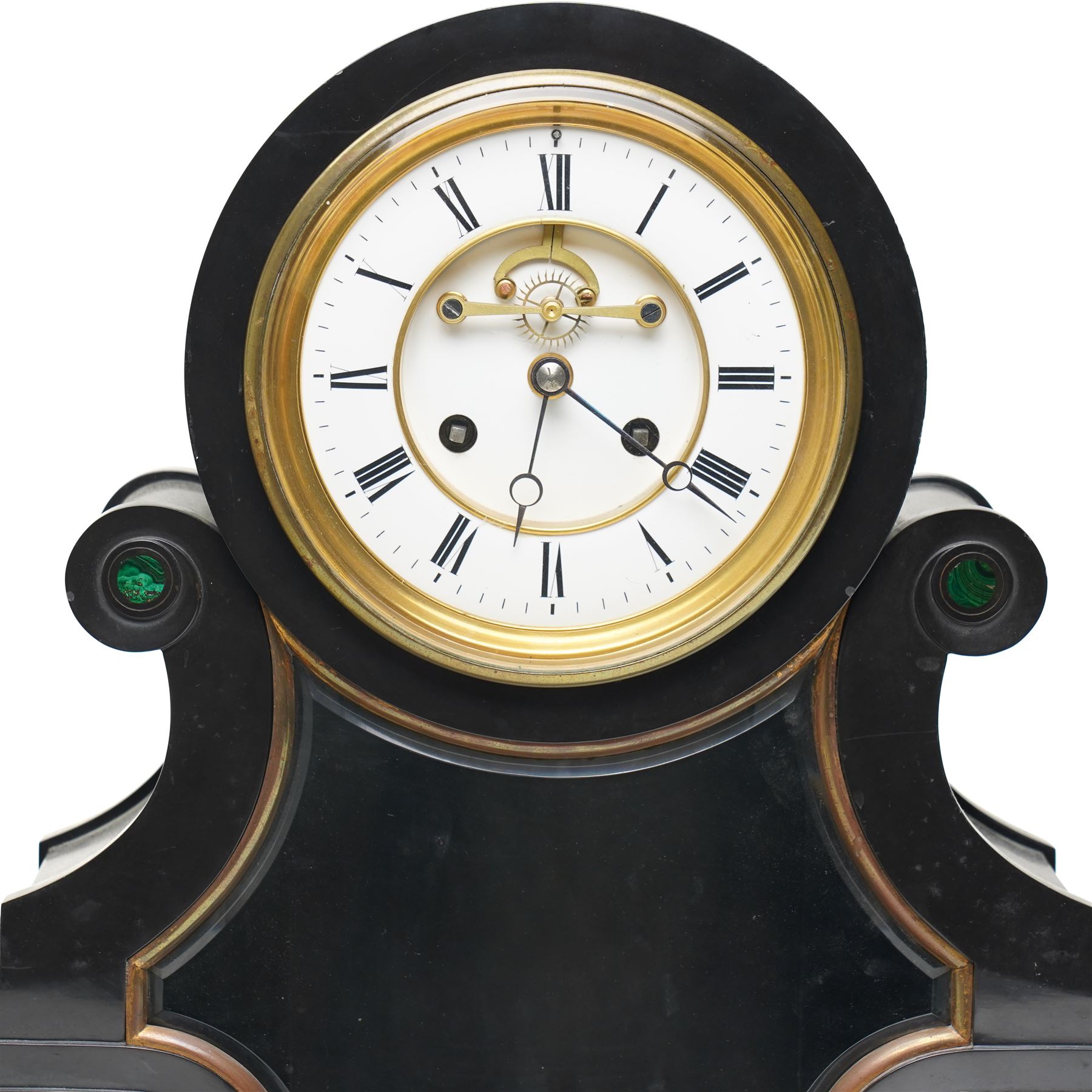 French-Late 19th century Belgium slate mantel clock, 8-day movement housed in a drum case with volutes, cradled within scroll supports and a shaped pendulum viewing glass with a brass surround, stepped plinth with incised decoration and malachite panels, two-piece enamel dial within a cast brass bezel, dial with Roman numerals, minute markers and steel moon hands, visible Brocot dead-beat escapement fitted with cornelian pallets, twin train going barrel movement with rack striking, sounding the hours and half-hours on a bell. With the original twin file mercury pendulum.
 