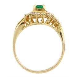 14ct gold emerald cut emerald, tapered baguette cut and round brilliant cut diamond crossover ring, stamped 14K 585