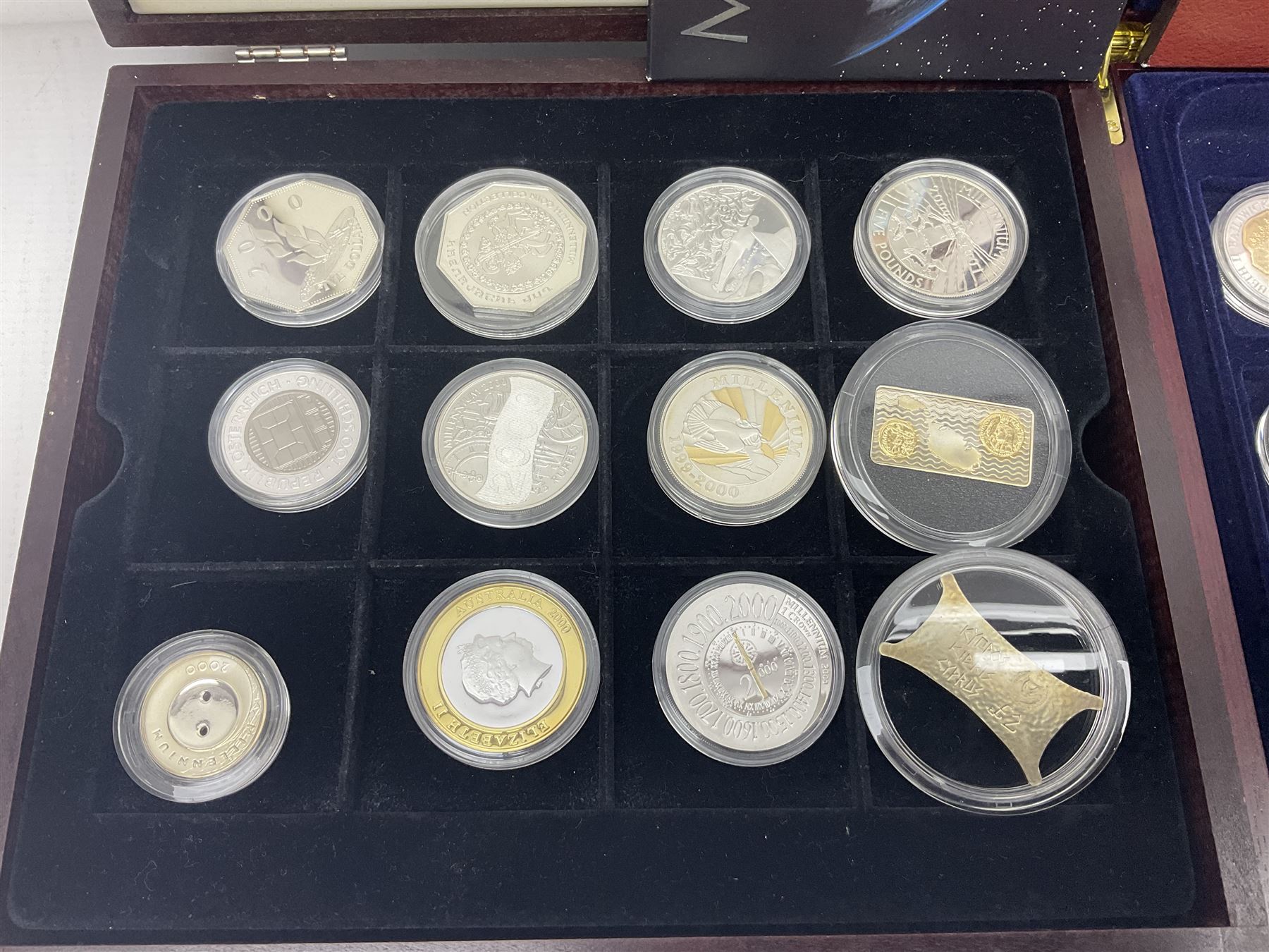 Single owner lifetime collection of mostly commemorative modern World coins with gold, silver and base metal examples, including two Queen Elizabeth II Bailiwick of Guernsey twenty-five pound gold coins 'The 1999 Royal Wedding' and '100th Anniversary of the End of the Victorian Era' 2001 each in 24 carat gold weighing 7.81 grams with certificates, silver coins commemorating the Millennium 2000 including Guyana sterling silver proof two-thousand dollars, Fiji sterling silver proof five dollars etc, silver coins from the Queen Elizabeth II Golden Jubilee Collection dated either 2002 or 2003 from Great Britain and the Commonwealth countries, United Kingdom commemorative crowns in card folders, The Royal Mint United Kingdom 1997 proof coin set in red folder without certificate etc