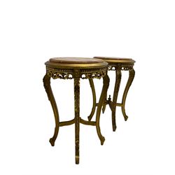 Pair French style giltwood lamp or side tables, circular top with rouge marble insets, carved and pierced with floral decoration, on cabriole supports joined by x frame stretchers with finial